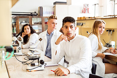 Group of young international students in a lab